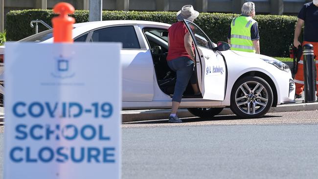 Health and school officials at Brisbane Boys Grammar which was closed due to the Covid outbreak in August. Photo: Lyndon Mechielsen