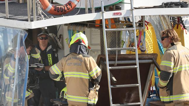 Emergency services on-board the boat vessel. Picture: Alison Wynd