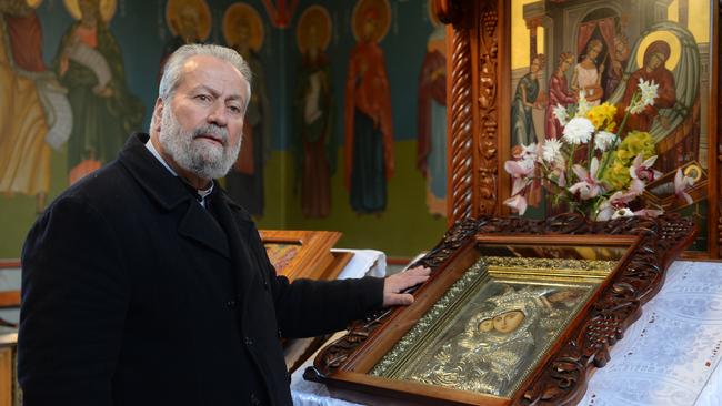 Red Hill Greek Orthodox Church’s Fr Eleftevios Tatsis with the stole Virgin Mary icon. Picture: Susan Windmiller