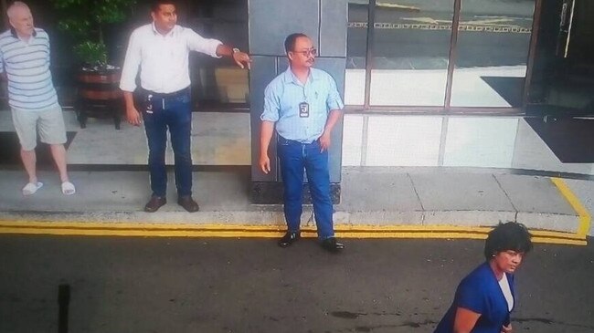 Security camera footage of Annapuranee Jenkins outside Hotel Jen in Penang, Malaysia, about 2.45pm on December 13, 2017. Her husband Frank Jenkins, far left, watches on.