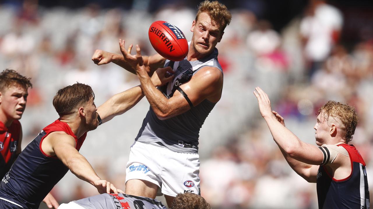 Jack Watts handpasses the ball under pressure against his old club Melbourne on Saturday. Picture: AAP Image/Daniel Pockett