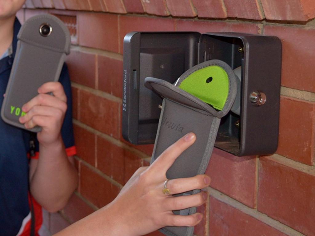 The pouches are opened via magnetic unlocking stations located around the school. Picture: Supplied
