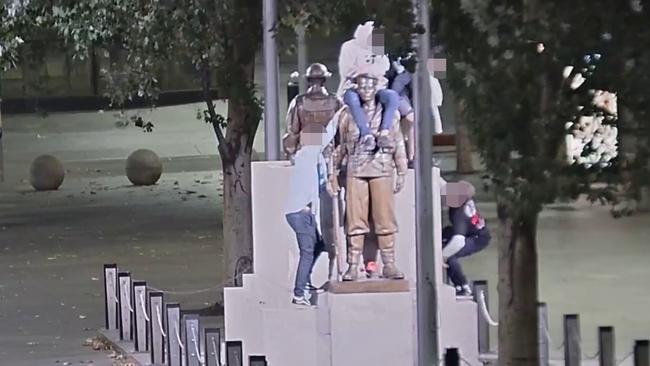 The group of young men on the memorial.