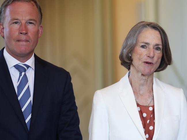 Premier Will Hodgman, left, listens while Tasmanian Governor Kate Warner addresses the media at Government House. Picture: LUKE BOWDEN