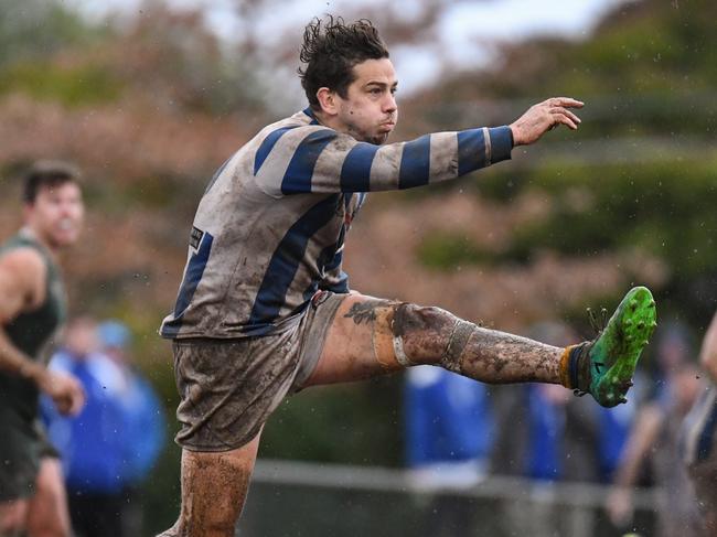 Macleod and Greensborough slog it out in the wet in the Northern Football League. Pictures: Nathan McNeill.