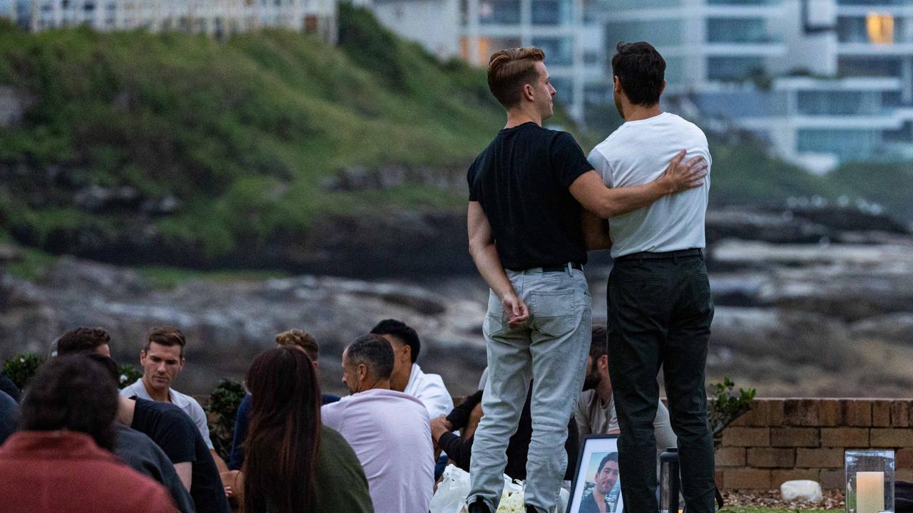 At least 60 people gathered at Bronte on Tuesday to mourn Jesse Baird and Luke Davies. Picture: NCA NewsWire/ Ben Symons