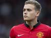 Manchester United debutant James Wilson takes to the pitch before his team's English Premier League soccer match against Hull at Old Trafford Stadium, Manchester, England, Tuesday May 6, 2014. (AP Photo/Jon Super)