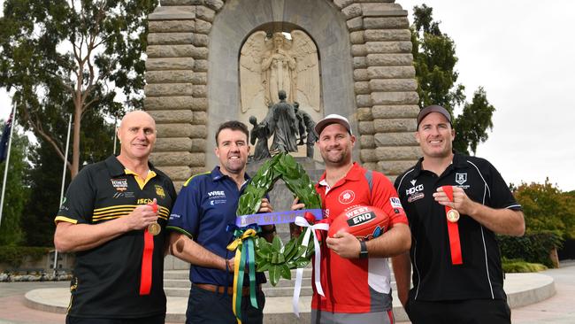 21/4/21. SANFL Anzac Round -  4 Coaches - Glenelg's Brett Hand, Eagles' Jade Sheedy, North Adelaide's Jacob Surjan and Port Adelaide's Matthew Lokan at the Adelaide National War Memorial.Picture: Keryn Stevens