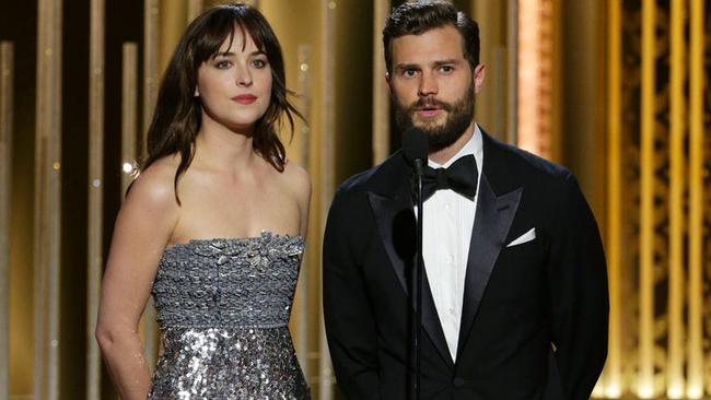 Co-stars ... Dakota Johnson and her Fifty Shades of Grey co-star Jamie Dornan at the Golden Globes. Picture: AP