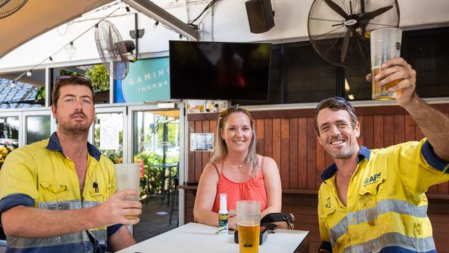 Ryan McGregor, left, and Cara and Mark Talbot enjoy their beers as Darwin pubs reopened on Friday. Picture: Amos Aikman