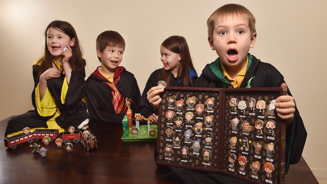 Coco, 7, Arley, 8, Yumi, 5, and Rafe, 6, play with the new Harry Potter Coles collectibles. Picture: Nicki Connolly