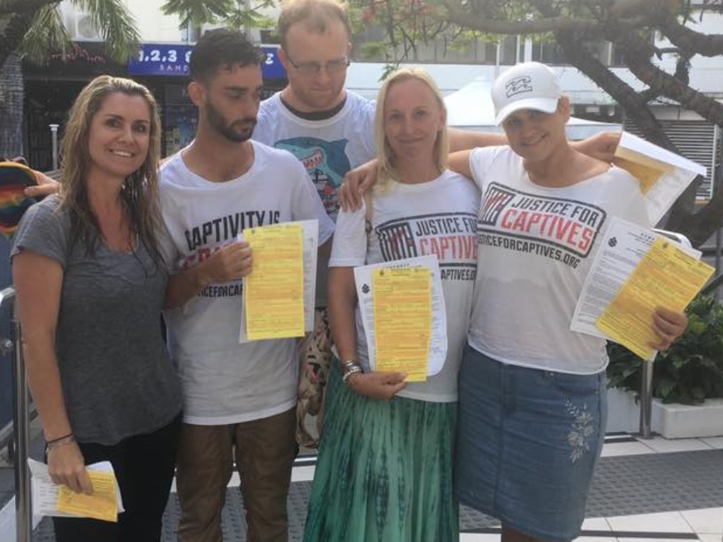 Protesters show off their infringement notices. Picture: Justice for Captives/Facebook