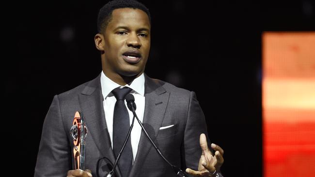 FILE - In this April 14, 2016 file photo, Nate Parker, director of the upcoming film "The Birth of a Nation," accepts the Breakthrough Director of the Year award during the CinemaCon 2016 Big Screen Achievement Awards in Las Vegas. (Photo by Chris Pizzello/Invision/AP)