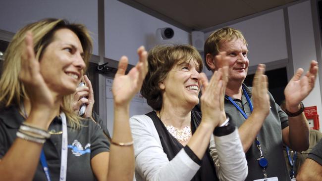 Scientists celebrate in the scientific mission observation centre of the French space agency Centre National d'Etudes Spatiales (CNES) in Toulouse, southern France / Picture: AFP