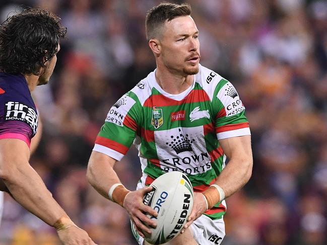 Damien Cook of the Rabbitohs (right) in action during the Round 23 NRL match between the Brisbane Broncos and the South Sydney Rabbitohs at Suncorp Stadium in Brisbane, Thursday, August 16, 2018. (AAP Image/Dave Hunt) NO ARCHIVING, EDITORIAL USE ONLY