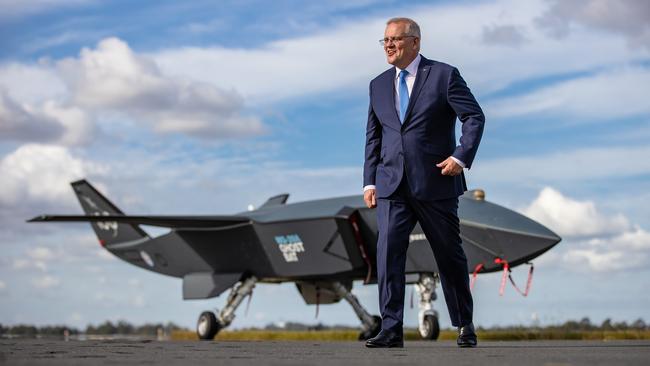 Prime Minister Scott Morrison with a Ghost Bat drone while visiting RAAF base Amberley, near Ipswich in Queensland. Picture: Jason Edwards