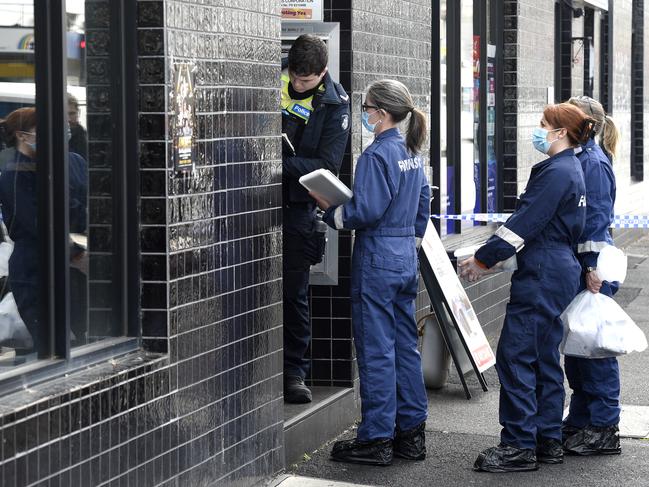 Police at the Footscray apartment block where the woman was stabbed. Picture: Andrew Henshaw