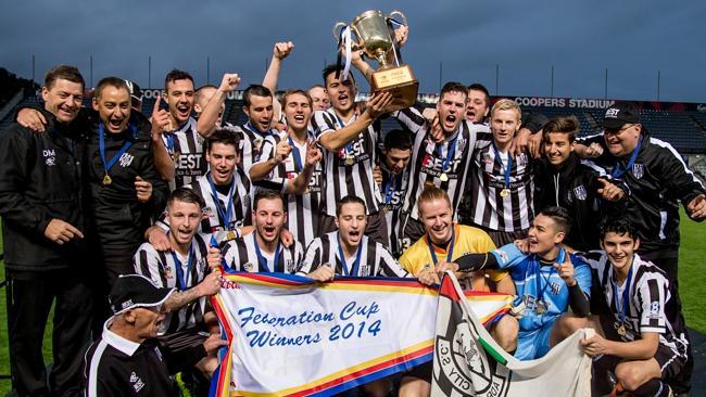 Adelaide City players celebrate yesterday’s Federation Cup final win over West Adelaide a