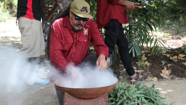 Astro Brim performs a traditional smoking ceremony for around 200 hikers and mountain bike riders at the opening of the first stage of the Wangetti Trail in Palm Cove on Wednesday, September 25, 2024.