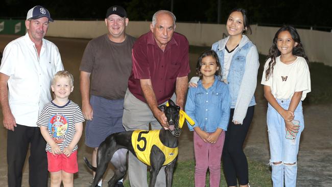 Long-serving Ipswich greyhound official and trainer Merv Page with connections celebrating the win of Sizzling Babe. Picture: justgreyhoundphotos.com.au