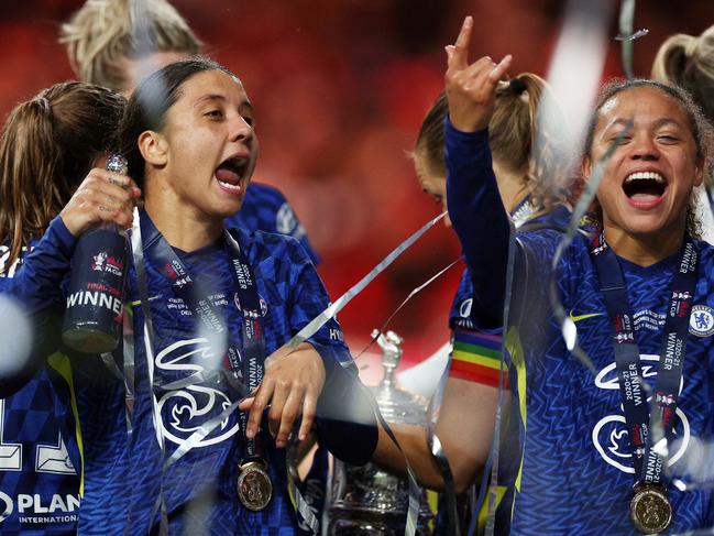 LONDON, ENGLAND - DECEMBER 05: Sam Kerr of Chelsea celebrates with champagne after their sides victory in the Vitality Women's FA Cup Final between Arsenal FC and Chelsea FC at Wembley Stadium on December 05, 2021 in London, England. (Photo by Richard Heathcote/Getty Images)