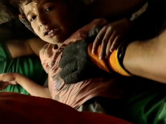 Boy and baby brother pulled alive from rubble after Israeli strike