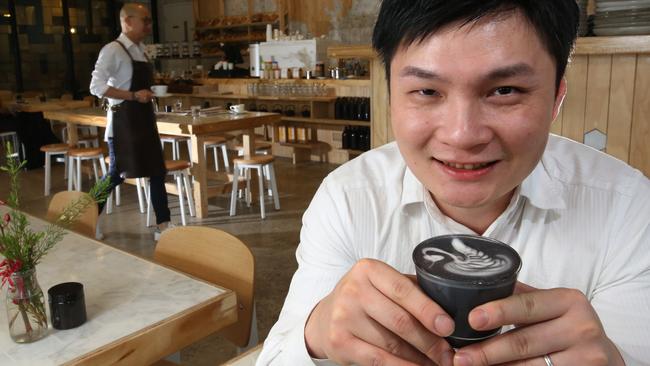 White Mojo manager Jia Wang with the black latte. Picture: Stuart Milligan