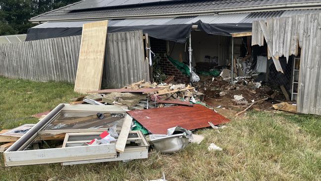 The house suffered extensive damage when the car crashed through fences and into two rooms. Picture: Jack Colantuono