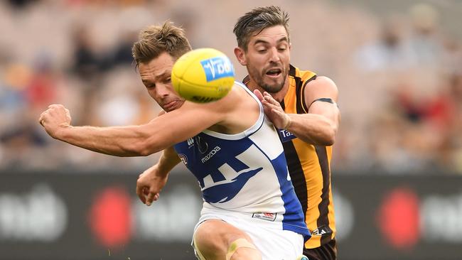 Ricky Henderson puts Shaun Higgins off his kick. Picture: AAP