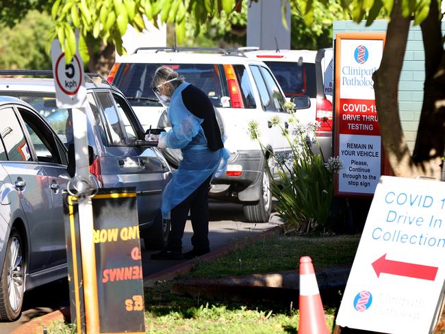 Members of the public attend the Rivervale drive-through COVID-19 testing clinic in Perth on Monday. Picture: Kane/Getty