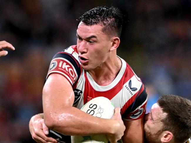 BRISBANE, AUSTRALIA - MAY 15: Joseph Manu of the Roosters takes on the defence during the round 10 NRL match between the Sydney Roosters and the Parramatta Eels at Suncorp Stadium, on May 15, 2022, in Brisbane, Australia. (Photo by Bradley Kanaris/Getty Images)