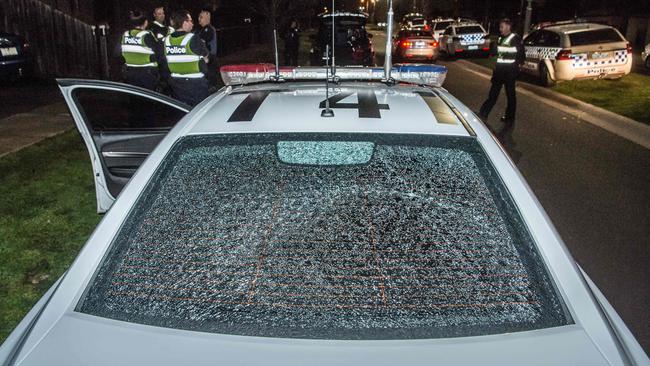 A police car was damaged during the riot. Picture: Jason Edwards