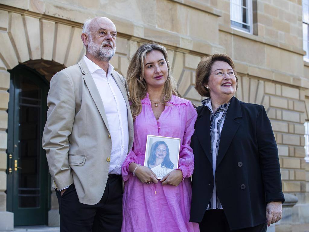 Commission of Inquiry being tabled in parliament, Craig, Amanda (holding a picture of Zoe) and Anne Duncan. Picture: Chris Kidd