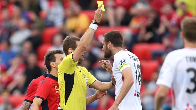 Robert Cornthwaite of Western Sydney Wanderers FC gets a yellow card