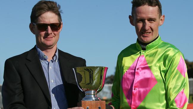 Trainer Jarrod McLean with jockey Shane Jackson after Cougar Express at the Grand National Hurdle in August. Picture: AAP