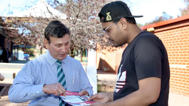 Tony Zappia at Pooraka Primary, where he met local voters, including first time voter, Kashyap Patel. Picture: Dean Martin