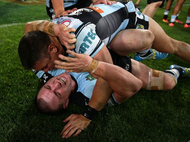 Paul Gallen and Chris Heighington celebrate winning the 2016 NRL Grand Final. Picture: Brett Costello