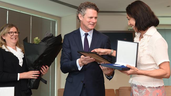 HWT chair Penny Fowler and Herald Sun editor Damon Johnston present Bronwyn Covill her medal. Picture: Josie Hayden