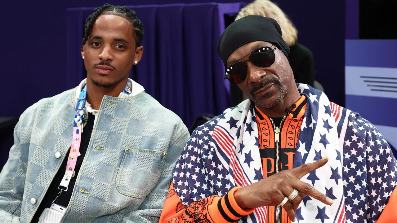 US rapper and sports commentator Snoop Dogg at the men's foil team round with his son Cordell Broadus. Picture: AFP