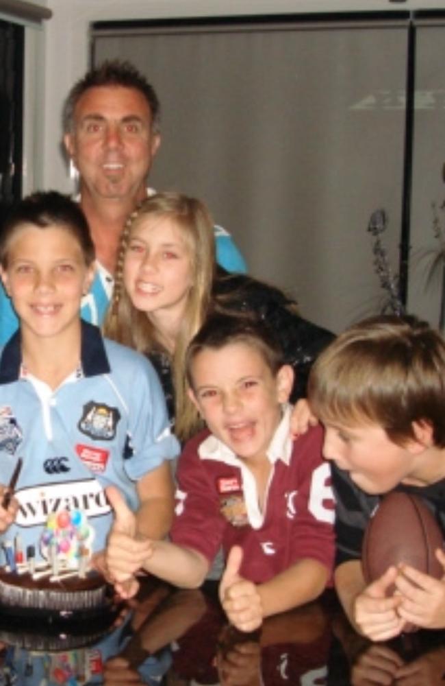 Trent Loiero (middle) as a child in his treasured Queensland Maroons jersey.