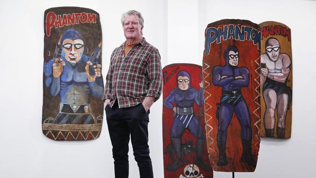 Tribal art dealer Chris Boylan displays war shields from the PNG Highlands emblazed with The Phantom. Picture: Sam Ruttyn