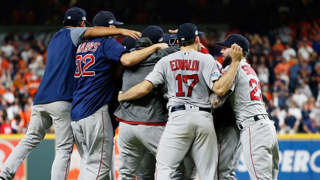 HOUSTON, TX - OCTOBER 18: The Boston Red Sox celebrate defeating the Houston Astros 4-1 in Game Five of the American League Championship Series to advance to the 2018 World Series at Minute Maid Park on October 18, 2018 in Houston, Texas.   Bob Levey/Getty Images/AFP == FOR NEWSPAPERS, INTERNET, TELCOS & TELEVISION USE ONLY ==