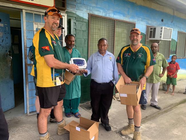 Scott Campbell and Stuart Jonklaas of Kokoda Campaign Tours providing medical equipment to Popondetta Hospital in Papua New Guinea.