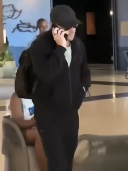 The actor abruptly took a phone call while exiting the hotel.