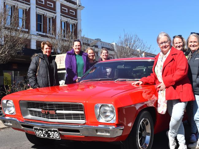 (clockwise from left) Kerry Fowler, Fran Moore, Leigh Whitlock, Jo Burton, Bernadette Barr, Michelle Beith, and Jodie Chambers at the Grand Automobile Display during Jumpers and Jazz in July 2022. Photo: Jessica Paul / Warwick Daily News