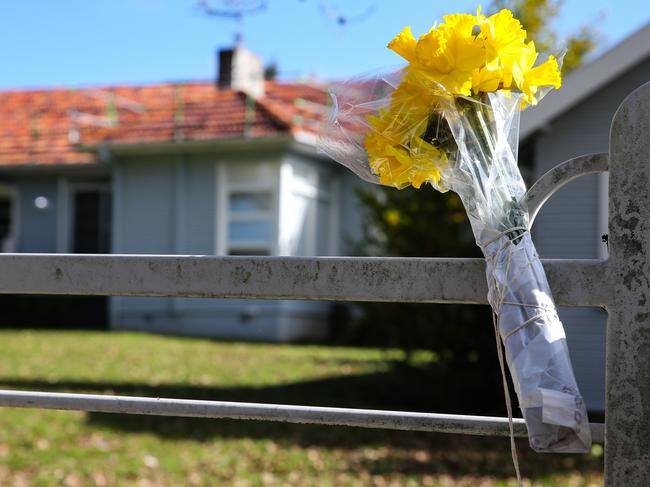 The home where Carlino was arrested, where a bunch of flowers was left by a neighbour on Sunday. Picture: Gaye Gerard