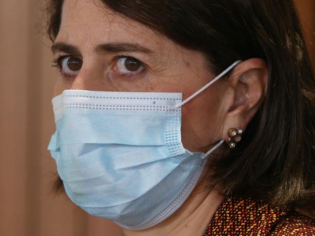 SYDNEY, AUSTRALIA - JULY 26: NSW Premier Gladys Berejiklian wears a face mask during a COVID-19 update and press conference on July 26, 2021 in Sydney, Australia. Lockdown restrictions remain in place as NSW continues to record new community COVID-19 cases and work to stop the spread of the highly infectious delta coronavirus strain in the community. Greater Sydney including the Central Coast, Blue Mountains, Wollongong and Shellharbour require all non-essential retail to close. Businesses can still operate click and collect, takeaway and home delivery. In addition to stay at home orders, residents in the local government areas of Fairfield, Canterbury-Bankstown, Blacktown, Cumberland and Liverpool cannot leave their areas for work except for emergency services and healthcare workers. Where those workers do need to leave their local government area for work, they are required to be tested every three days, even if they do not have symptoms. Residents of Greater Sydney, the Blue Mountains, the Central Coast and Wollongong are subject to stay-at-home orders with people are only permitted to leave their homes for essential reasons. Essential reasons include purchasing essential goods, accessing or providing care or healthcare, essential work, education or exercise. Exercise is restricted to within the local government area and no further than 10km from home and with a maximum of two people per group. Browsing in shops is prohibited and only one person per household can leave home for shopping per day. Outdoor public gatherings are limited to two people, while funerals are limited to 10 people only. The restrictions are expected to remain in place until 11:59 pm on Friday 30 July. (Photo by Lisa Maree Williams Pool/Getty Images) (Photo by Lisa Maree Williams/Getty Images)