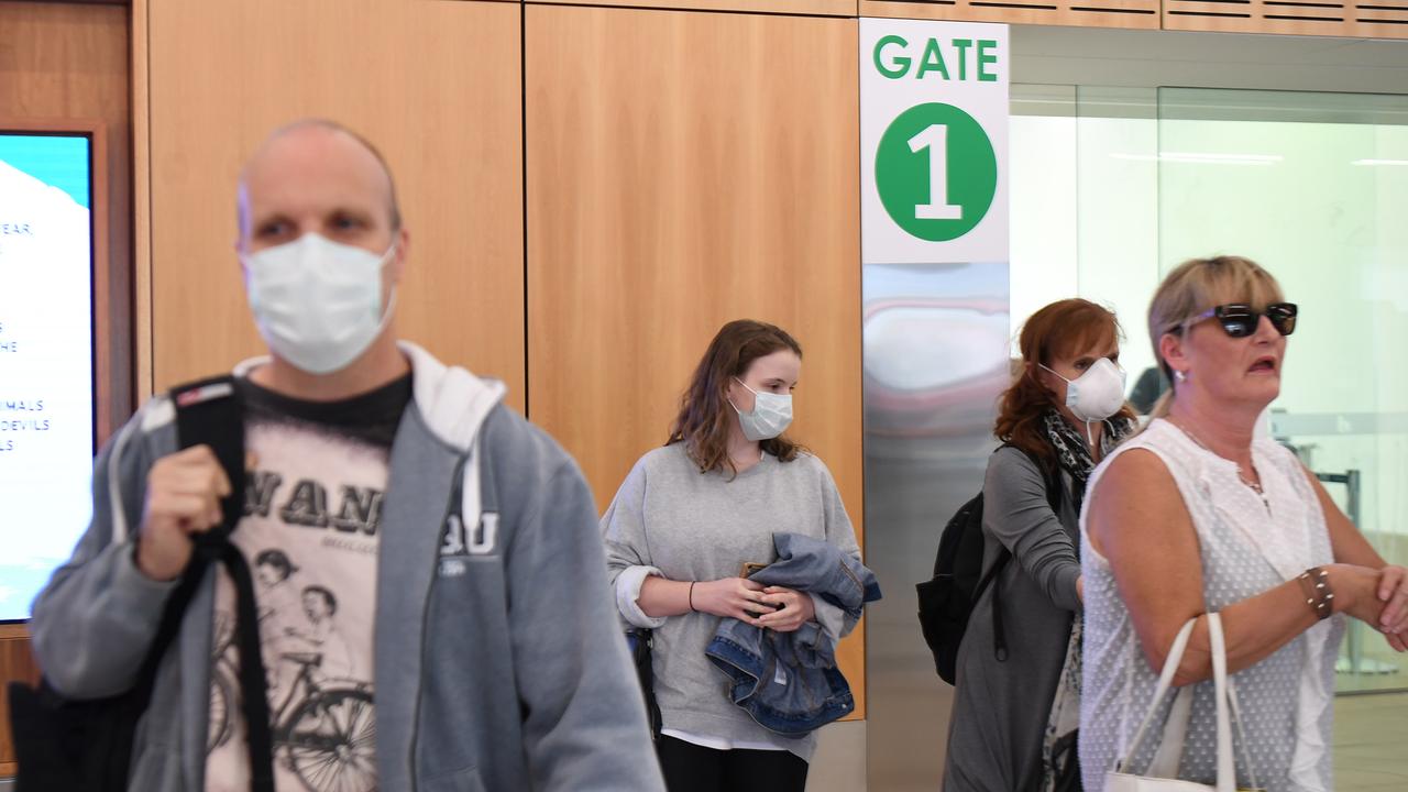 HOBART, AUSTRALIA - MARCH 19: Passengers use supplied sanitiser on arrival at Hobart airport on March 19, 2020 at Hobart airport in Hobart, Australia. The Tasmanian premier Peter Gutwein has announced all interstate travellers will be required to quarantine for 14 days. The measures are the toughest to be imposed in Australia, and will come into effect from Friday 20 March. There are now 596 confirmed cases of COVID-19 In Australia, while there have been six confirmed deaths, five in NSW and one in Western Australia. (Photo by Steve Bell/Getty Images)