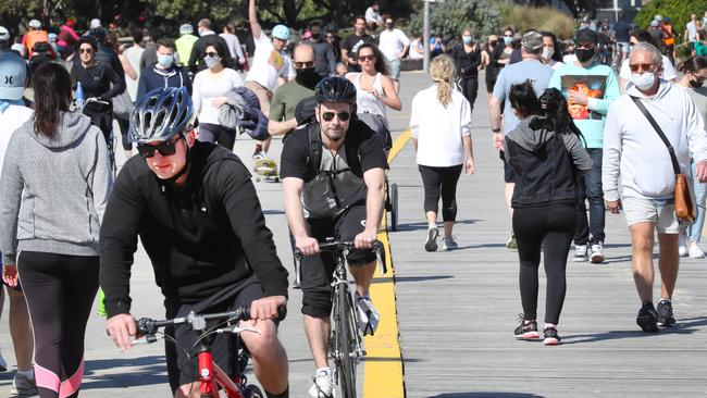 Crowds at St Kilda foreshore on Saturday. Picture: David Crosling