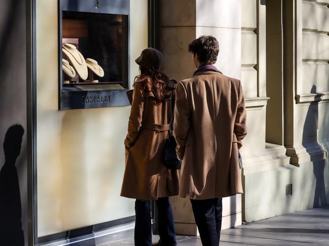 Window shoppers at the Paris end of Collins St. Picture: Ian Currie